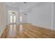 Open living space with hardwood floors, clerestory windows, and modern lighting fixture at 1803 Glenbay Ct, Windermere, FL 34786