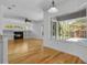 Sunlit living room with fireplace and large windows overlooking pool area at 1803 Glenbay Ct, Windermere, FL 34786