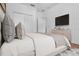 Comfortable main bedroom featuring a TV, dresser, and closet for ample storage space at 1803 Glenbay Ct, Windermere, FL 34786