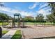 Neighborhood playground with swings, slide, green space and mature trees at 1803 Glenbay Ct, Windermere, FL 34786