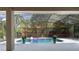 Private screened-in pool, surrounded by tropical landscaping at 1803 Glenbay Ct, Windermere, FL 34786