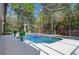 Inviting screened-in pool area offers lush landscaping and privacy at 1803 Glenbay Ct, Windermere, FL 34786