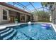 Sparkling pool features a sun shelf, beach ball, and a lovely backyard view at 1803 Glenbay Ct, Windermere, FL 34786