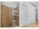 Walk-in shower with tile surround and glass door at 1803 Glenbay Ct, Windermere, FL 34786