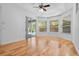 Bright sun room with hardwood floors and large windows at 1803 Glenbay Ct, Windermere, FL 34786