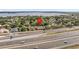 Aerial shot of house in a suburban area located near a highway and lake at 235 Largovista Dr, Oakland, FL 34787