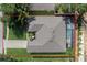 This aerial view showcases the home's roof, landscaping, and pool area at 235 Largovista Dr, Oakland, FL 34787