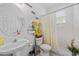 This bathroom features a shower, toilet, sink, and inspirational wall decor at 235 Largovista Dr, Oakland, FL 34787