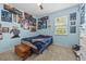 This bedroom features posters on the walls, a ceiling fan, and a bed at 235 Largovista Dr, Oakland, FL 34787