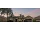 Exterior shot of single-story home with landscaped yard taken at dusk at 235 Largovista Dr, Oakland, FL 34787