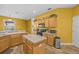 Open kitchen features wood cabinets, stainless appliances, and a center island at 235 Largovista Dr, Oakland, FL 34787