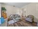 Comfortable living room with wood floors, neutral decor, and lots of natural light at 235 Largovista Dr, Oakland, FL 34787