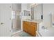 Clean main bathroom featuring a glass shower, large mirror, and corner tub at 235 Largovista Dr, Oakland, FL 34787
