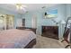 Cozy bedroom featuring a ceiling fan and large dresser, creating a relaxed atmosphere at 235 Largovista Dr, Oakland, FL 34787