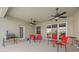 This patio features ceiling fans, outdoor chairs and a grill, perfect for entertaining or relaxing at 235 Largovista Dr, Oakland, FL 34787