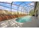 Enjoy the private screened-in pool with a fountain, offering a serene outdoor retreat at 235 Largovista Dr, Oakland, FL 34787