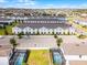 An aerial shot showcasing townhomes with parking, landscaping, and pools in an established neighborhood at 2432 Tangier Dr, Kissimmee, FL 34747