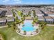 Aerial view of a Primary-planned community featuring a central pool and amenity center at 2432 Tangier Dr, Kissimmee, FL 34747