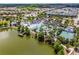 Aerial shot of a recreational area with pools, lazy river, water slides, and sports courts at 2432 Tangier Dr, Kissimmee, FL 34747