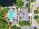 Overhead view of a community clubhouse, pool, and outdoor areas with a lake at 2432 Tangier Dr, Kissimmee, FL 34747
