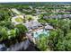 An aerial view of the community clubhouse, pool and lake at 2432 Tangier Dr, Kissimmee, FL 34747
