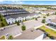 Overhead view of townhomes featuring on-site parking, landscaping, nearby pool, and neighborhood amenities at 2432 Tangier Dr, Kissimmee, FL 34747