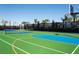 Brightly colored community tennis and basketball court, perfect for a fun game with friends at 2432 Tangier Dr, Kissimmee, FL 34747