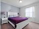 Bedroom showcasing a bed, window with sheer curtains, and nightstands with lamps at 2432 Tangier Dr, Kissimmee, FL 34747