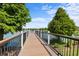 Scenic boardwalk offering relaxing views of the tranquil lake and lush surroundings at 2432 Tangier Dr, Kissimmee, FL 34747