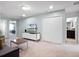 Bright bonus room featuring a TV, a comfortable sofa, closet, and neutral carpet at 2432 Tangier Dr, Kissimmee, FL 34747