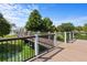 Picturesque bridge overlooking a lush pond, connecting different parts of the community at 2432 Tangier Dr, Kissimmee, FL 34747