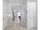 Bright hallway with tile flooring leads to the living area and stairs at 2432 Tangier Dr, Kissimmee, FL 34747