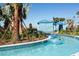 Enjoy the relaxing lazy river with blue cabanas and lush landscaping at 2432 Tangier Dr, Kissimmee, FL 34747