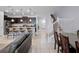 Spacious living space with open kitchen, dining area, and staircase at 2432 Tangier Dr, Kissimmee, FL 34747