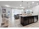 Open concept living room and kitchen area featuring modern decor and lots of natural light at 2432 Tangier Dr, Kissimmee, FL 34747