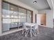 Covered patio with outdoor seating and sliding glass doors for indoor-outdoor living at 2432 Tangier Dr, Kissimmee, FL 34747
