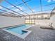 Enclosed pool area with lounge chairs and brick paving, perfect for outdoor enjoyment at 2432 Tangier Dr, Kissimmee, FL 34747