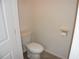 A tidy half-bathroom features a standard toilet and a marble-accented toilet paper holder at 245 Brunswick Dr, Davenport, FL 33837