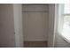 Walk-in closet with double doors, rod and shelf, and window at 245 Brunswick Dr, Davenport, FL 33837