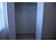 Walk-in closet with double doors, rod and shelf, and window at 245 Brunswick Dr, Davenport, FL 33837