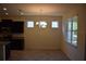 Dining area with chandelier lighting, neutral paint, and a large window at 245 Brunswick Dr, Davenport, FL 33837