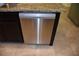 Stainless steel dishwasher seamlessly integrated into the kitchen island, adding convenience to the space at 245 Brunswick Dr, Davenport, FL 33837