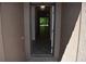 Neutral colored entrance and tiled foyer leading to the living area provides a welcoming introduction at 245 Brunswick Dr, Davenport, FL 33837