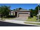 Charming single-story home featuring a well-manicured front yard and a two-car garage at 245 Brunswick Dr, Davenport, FL 33837
