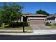 Charming single-story home featuring a well-manicured front yard and a two-car garage at 245 Brunswick Dr, Davenport, FL 33837