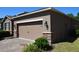 Close up of garage door and front of home at 245 Brunswick Dr, Davenport, FL 33837