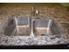 Close-up of a stainless steel, double basin kitchen sink and granite countertop, highlighting quality and design at 245 Brunswick Dr, Davenport, FL 33837