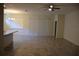 Open floor plan features neutral tile flooring and large windows providing ample natural light at 245 Brunswick Dr, Davenport, FL 33837