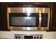 A built-in stainless steel microwave offers convenience and style in this modern kitchen at 245 Brunswick Dr, Davenport, FL 33837