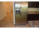 Stainless steel refrigerator with water dispenser complements the modern kitchen's design and functionality at 245 Brunswick Dr, Davenport, FL 33837